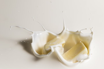 white chocolate falls in milk