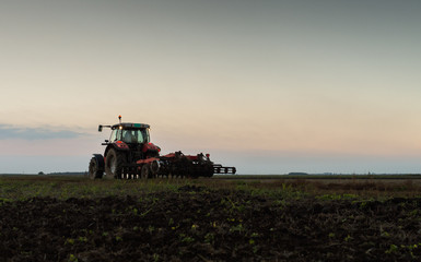 Tractor plowing a field