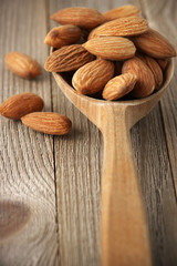 Almonds in wooden spoon