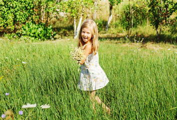 Little girl running on meadow