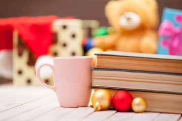 Cup of coffee or tea with books