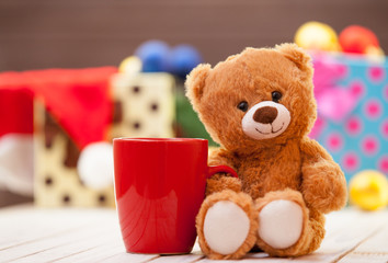 Teddy bear with cup of coffee or tea
