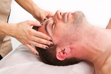 Fototapeta na wymiar Man getting massage in thebeauty center