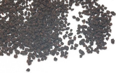 dry black tea on a white background
