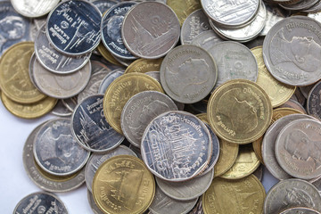 Thai Baht coins scattered all over the place for background