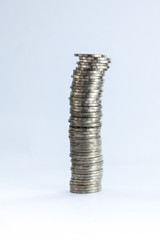 group of coins stacking up in white isolated background.