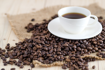 Fototapeta na wymiar coffee beans and cup of coffee