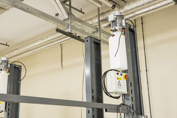 Hydraulic lifts for the car in the underground parking.