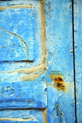 dirty stripped   in the blue wood   rusty nail