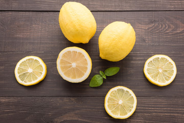Fresh slice lemon on the wooden background