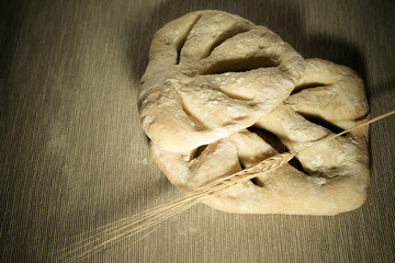 Fresh homemade bread on light grey table. Selective focus. Shall