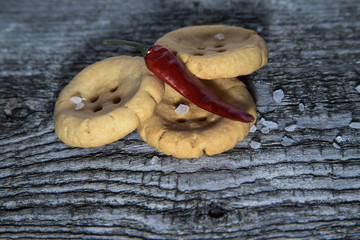 Cheese pastry shape like a button with seasalt and dry red hot c