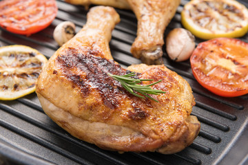 Grilled chicken lag and vegetables in a pan