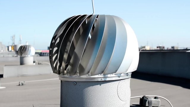 Metal silver ventilation turbine on rooftop