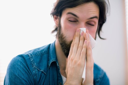 Sick Man Blowing His Nose