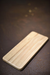 Wood plate on rusty background