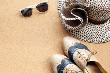 Fototapeta na wymiar Shoes, sunglasses and hat