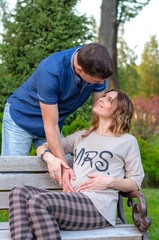 Young couple - hugs at the autumn park