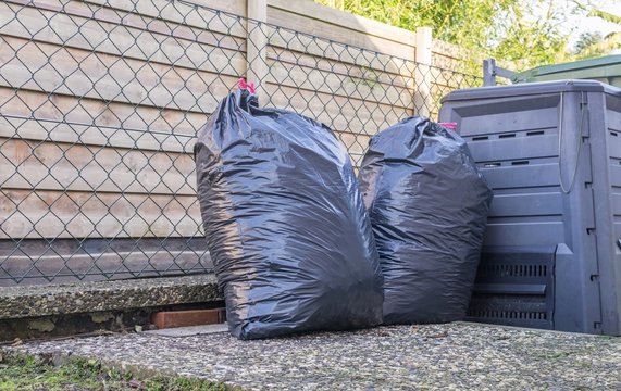 Plastic bin bags full of household rubbish 