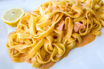 tasty pasta with salmon on a the table