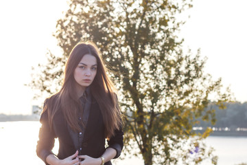 beautiful young girl on the background of nature