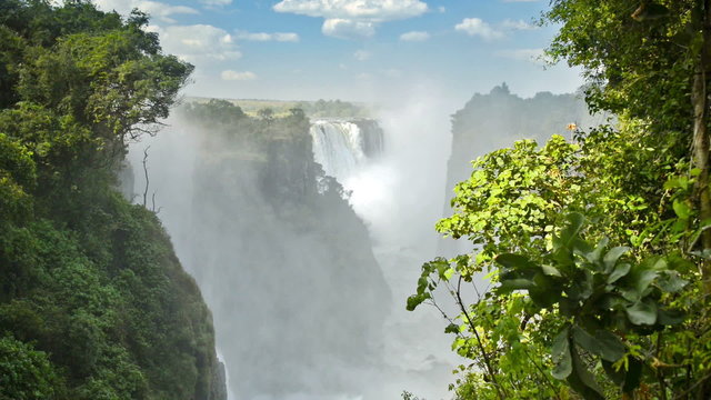 Victoria Falls Devils Cataract or Mosi-oa-Tunya waterfall in southern Africa on the Zambezi River at the border of Zambia and Zimbabwe in high definition footage. 