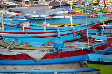 Fototapeta na wymiar Colorful boats background on the fish market in Bali