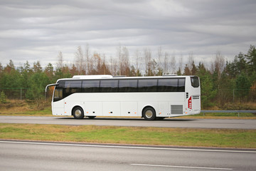 White Coach Bus on Motorway on a Cloudy Day © Taina Sohlman