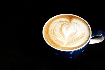 a cup of latte art coffee.