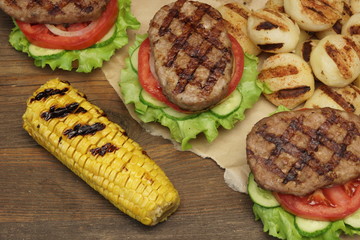Lunch With Homemade BBQ Grilled Hamburgers On The Picnic Table