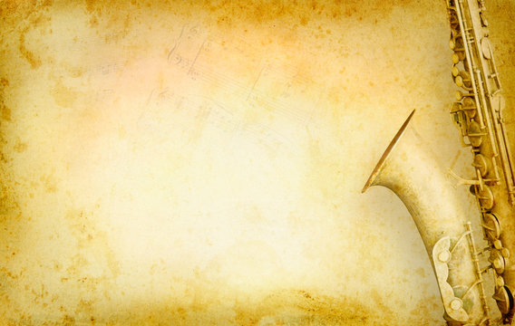 Grunge musical background with old saxophone