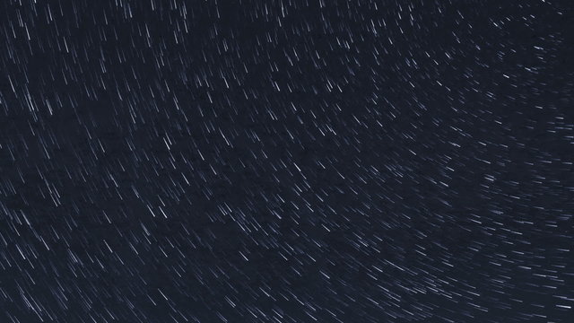 Long time lapse of circular moving stars on night sky with long trails, frame filling, no foreground elements