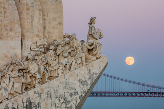 Supermoon over bridge by Padrao dos Descobrimentos, Lisbon, Portugal