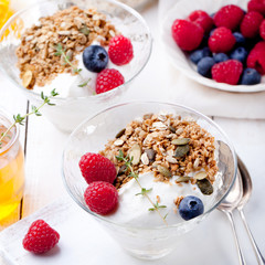 Healthy breakfast. Granola with pumpkin seeds, honey, yogurt, fresh berries .