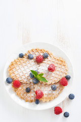 thin Belgian waffles with berries, top view