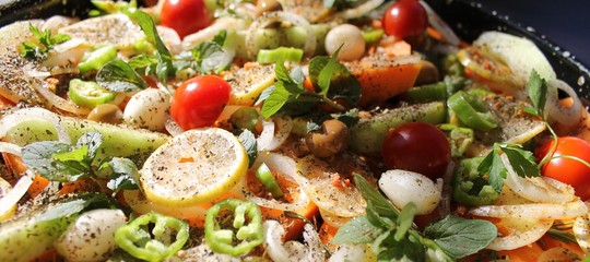 Pumpkin orange slices sweet baked in the oven with vegetables and spices