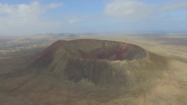 AERIAL: Majestic extinct volcano in the middle of volcanic island