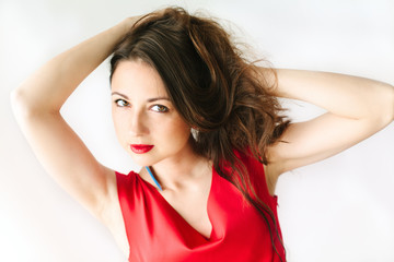 Fototapeta premium portrait of a young beautiful women in red dress with brunette h