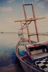 Fishing boat agrounding on the shore