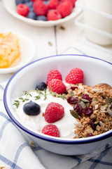 Healthy breakfast. Granola with pumpkin seeds, honey, yogurt ,fresh berries.