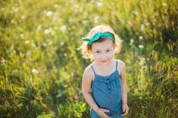 Portrait of a little girl walking in the field