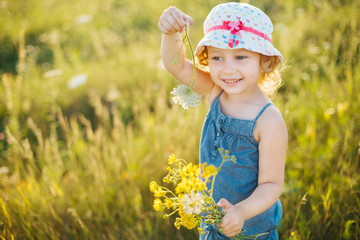Portrait of a little girl walking in the field