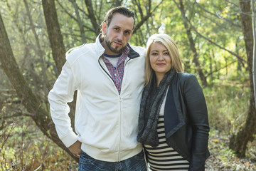 Fototapeta premium Happy middle aged couple outdoors on beautiful autumn day