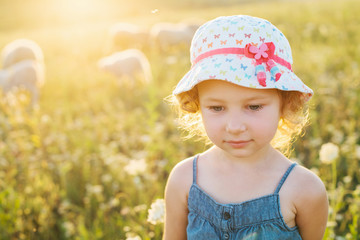 Portrait of a little girl walking in the field