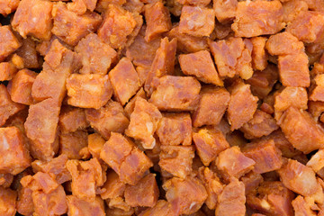 Chopped pepperoni pizza topping close view