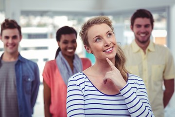 Happy creative team standing together