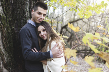 Teen couple at autumn park