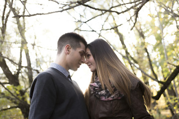 Teen couple at autumn park