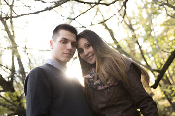 Teen couple at autumn park