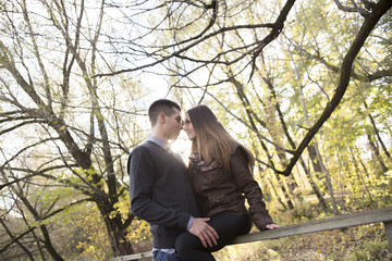 Fototapeta na wymiar Teen couple at autumn park